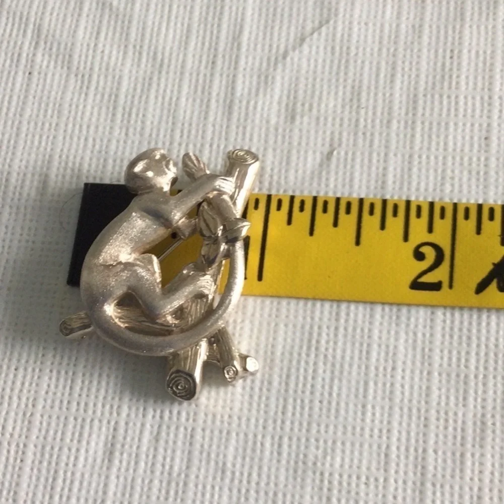 Woman’s Vintage Brooch of a Monkey on a branch made of Sliver